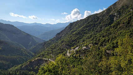 Obraz premium Route des Grandes Alpes M70 winding through french mountains near Col de Turini, Maritime Alps, France, Europe.