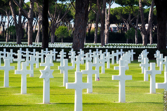 Sicily Rome American Cemetery White Marble Crosses and Stars of David Headstones World War II Military Memorial in Nettuno near Anzio Italy