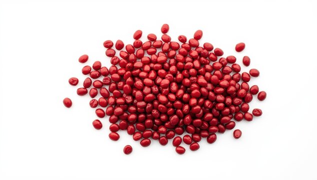 Raw red adzuki beans, Vigna angularis seeds, small dry legumes, used in Japanese desserts, on white background.