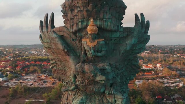 Majestic giant statue of Hindu god Vishnu riding mythical bird Garuda aerial drone view 4K