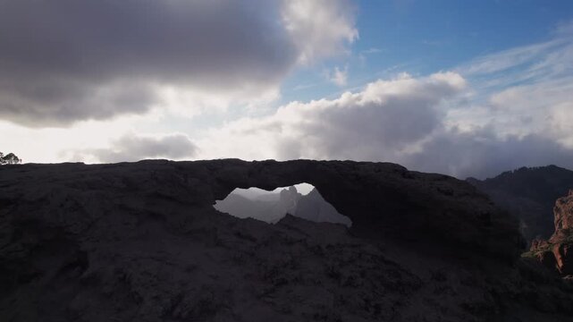Stunning view of the iconic Ventana del Nublo, a natural stone arch framing the famous Roque Nublo in Gran Canaria, Canary Islands