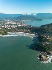 Obraz premium Sunny morning aerial view of Tenorio beach cove surrounded by nature in Ubatuba, Brazil
