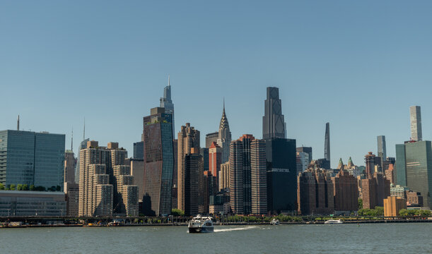 Scanic Murray Hill East River shore vista on a sunny summer day viewed from a boat, Manhattan, New York City