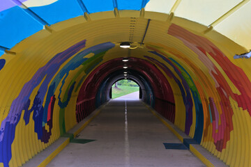 Symmetrical Colorful Abstract Mural Inside Pedestrian Greenway Tunnel © William Finn