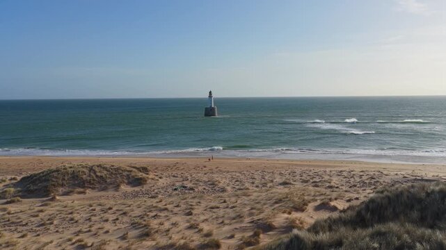 Rattray head lighthouse guiding ships in the north sea of scotland