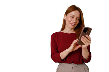 Fototapeta premium Woman smiling while using phone, social media communication, staying connected online with modern technology