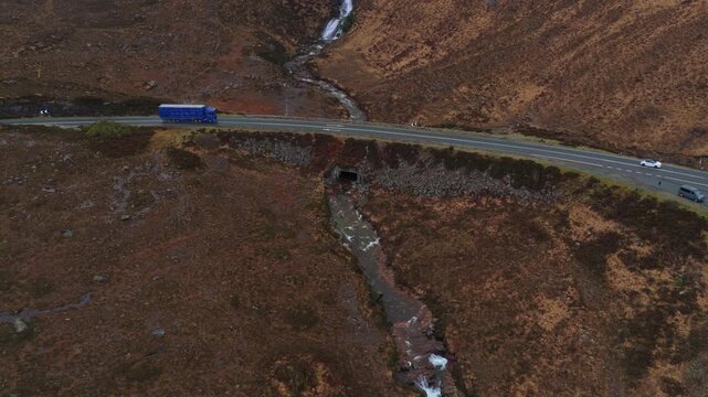 Aerial view of eas a' bhradain waterfall and stream in the scottish highlands