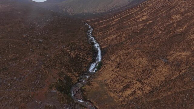 Aerial view flying over eas a' bhradain waterfall in scotland