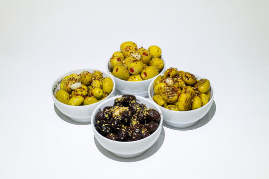 Breakfast olive varieties photographed on a white background.