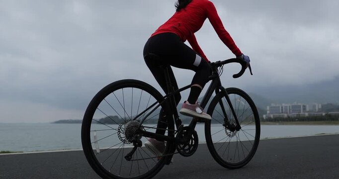 Riding bike on seaside road	