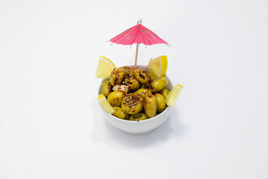 Breakfast olive varieties photographed on a white background.