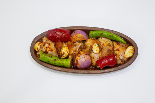 The indispensable accompaniment to kebabs and meat dishes: sumac onion salad. Photographic work on white oath