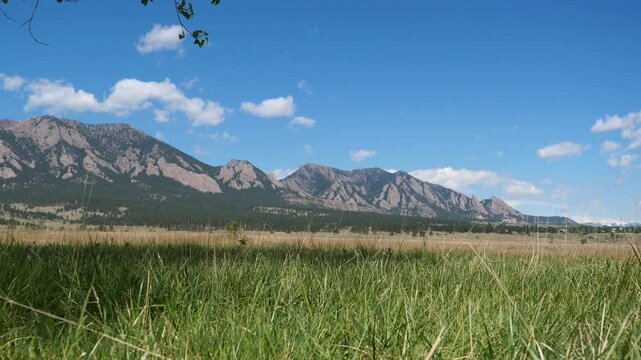 Prairie Grassland and Flatirons Mountains After Rain in Boulder Colorado, 4K Video