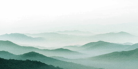 Misty morning mist rises over a serene mountain landscape with fog and dense green forest under a beautiful sunrise sky © alllluuuu