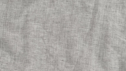 Fototapeta premium Light gray linen fabric with texture displayed on a flat surface in natural light