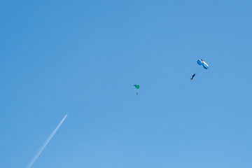 Fototapeta premium Paragliding adventure in blue sky