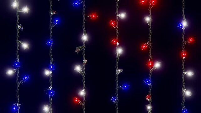 Horizontal 3D Independence Day 4th July stars lights garland patriotic USA background loop animation America holiday freedom celebration red white blue glowing night hanging string bulbs banner