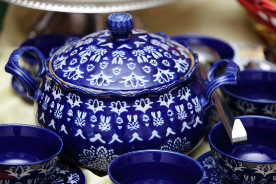 Ornate blue and white traditional Moroccan ceramic soup tureen and matching bowls
