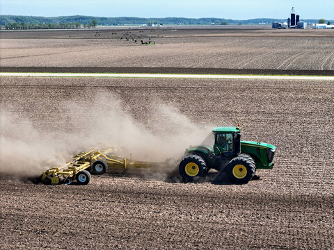 Thomson, Illinois, April 24, 2026, John Deere 9560R tractor pulling a Degelman Pro-Till 36 heavy-duty rotary tillage/soil cuktivator