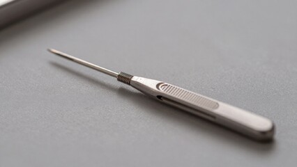 Fototapeta premium Close-up surgical instrument specifically tweezers placed textured surface made stainless steel smooth polishe