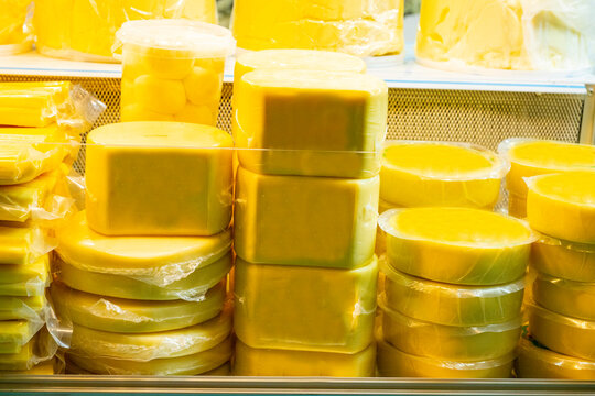 Various Turkish cheese on in diary production market. A lot of kind Turkish cheese  wheels on the shelves in diary production market. Food. Organic fresh chee se  skin and blocks of raw  in stainless 