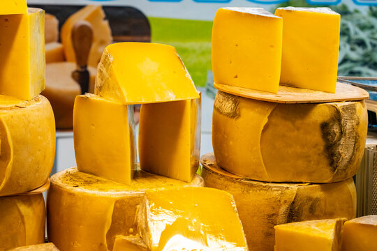 Various Turkish cheese on in diary production market. A lot of kind Turkish cheese  wheels on the shelves in diary production market. Food. Organic fresh chee se  skin and blocks of raw  in stainless 