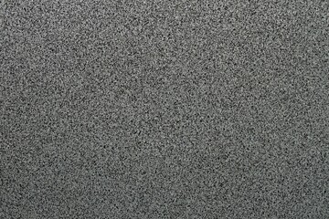 Fototapeta premium Detailed view on terrazzo cement background with small black and white stone grains