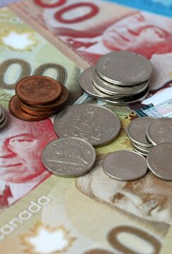 Canadian dollar money banknotes and coins on table. Canada cash bills of CAD currency