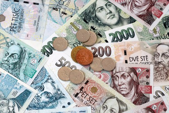 Czech koruna money banknotes and coins on table. Czech Republic cash bills of CZK currency