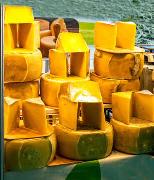 Various Turkish cheese on in diary production market. A lot of kind Turkish cheese  wheels on the shelves in diary production market. Food. Organic fresh chee se  skin and blocks of raw  in stainless 