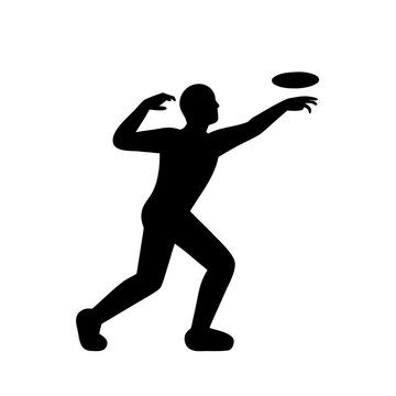 Silhouette of a man throwing a frisbee in the air