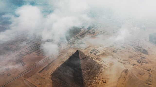 Pyramid Aerial Drone View Showing Ancient Structures in Desert Landscape Under Cloudy Sky for Historical Documentary and Tourism Promotional Footage