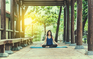 Spiritual young woman doing doing meditation and wellness yoga in a temple © IHERPHOTO