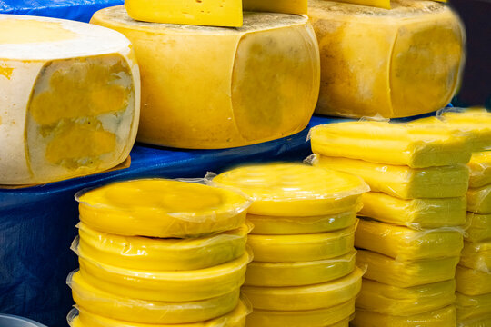 Various Turkish cheese on in diary production market. A lot of kind Turkish cheese  wheels on the shelves in diary production market. Food. Organic fresh chee se  skin and blocks of raw  in stainless 
