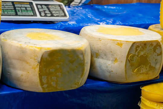 Various Turkish cheese on in diary production market. A lot of kind Turkish cheese  wheels on the shelves in diary production market. Food. Organic fresh chee se  skin and blocks of raw  in stainless 