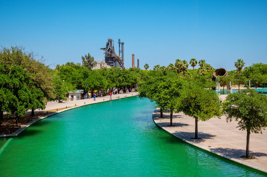 A high-angle shot captures the linear stretch of the Paseo Santa Luc&iacute;a canal flowing through Parque Fundidora in Monterrey, Nuevo Leon. Mexico.