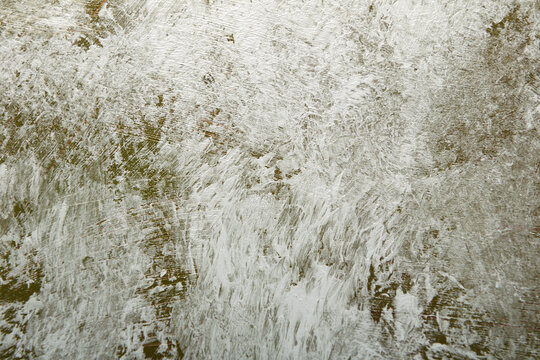 Art background of chaotic brush strokes in gray olive color