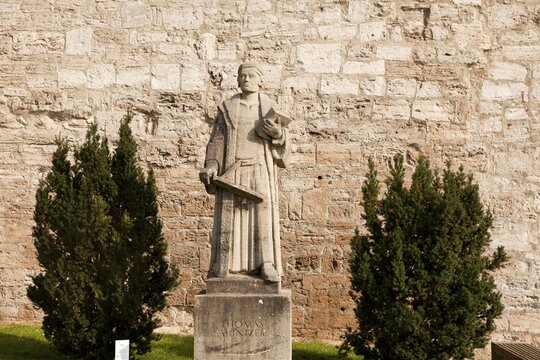 Statue of the preacher Thomas M&uuml;ntzer in front of the city walls of M&uuml;hlhausen, Unstrut Hainich district, Thuringia, Germany