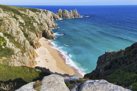 Treen cliffs and Pedn Vounder beach, South West Coast Path, coastline at Treen, St Levan, Penwith, Cornwall, England, United Kingdom