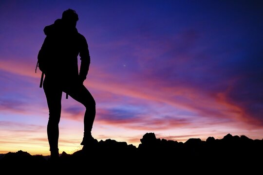 Silhouette of a female mountaineer at dawn, Hoher G&ouml;ll, Berchtesgaden Alps, Berchtesgaden National Park, Sch&ouml;nau am K&ouml;nigssee, Berchtesgadener Land, Upper Bavaria, Bavaria, Germany