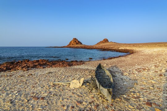 Little canoe on the rocky beach, Dihamri, island of Socotra, Yemen