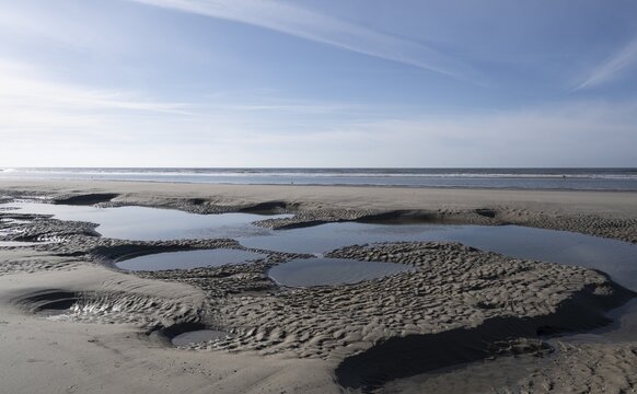 Sandy beach beach at low tide with tide pools, Juist Island, Lower Saxony Wadden Sea, North Sea, East Frisia, Lower Saxony, Germany