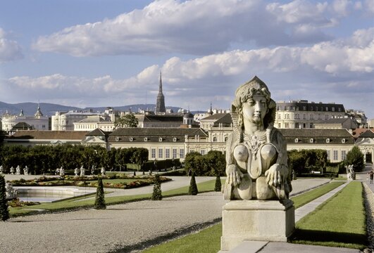 Sphinx in Belvedere garden with view to the castle, Belvedere, Vienna, Austria