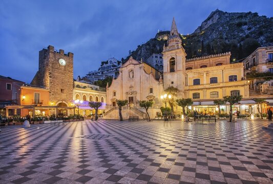 Belvedere Piazza IX Aprile with clock tower and church of San Giuseppe at dusk, Taormina, East Coast, Sicily, Italy