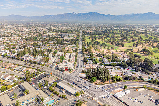 
Rosemead, California CA September 6, 2024: High Aerial City Drone View toward San Gabriel Blvd, Walnut Grove Ave, Whittier Narrows BMX, Los Angeles Rifle and Revolver Club, Golf Courses with Mountain