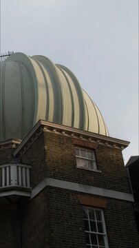 Vertical Timelapse of the Royal Observatory Greenwich Dome in London With Changing Light on Historic Brick Architecture