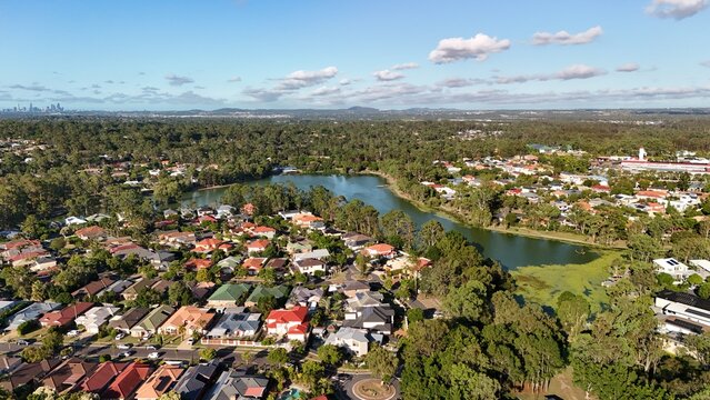 The Lake Parklands, Forest Lake, Brisbane, Queensland, Australia &ndash; 4K aerial drone view of suburban houses, residential estates, tree-lined streets, green spaces and outer south-western city