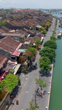 Aerial drone view of Hoi An city, Quang Nam province, Vietnam. Panoramic footage of Ancient town, UNESCO world heritage. One of the most travel popular touristic destinations
