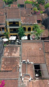 Aerial drone view of Hoi An city, Quang Nam province, Vietnam. Panoramic footage of Ancient town, UNESCO world heritage. One of the most travel popular touristic destinations
