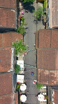 Aerial drone view of Hoi An city, Quang Nam province, Vietnam. Panoramic footage of Ancient town, UNESCO world heritage. One of the most travel popular touristic destinations
